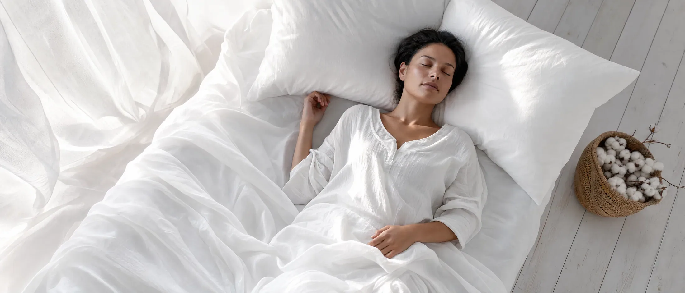 Guest resting in organic linen bedding, overhead view